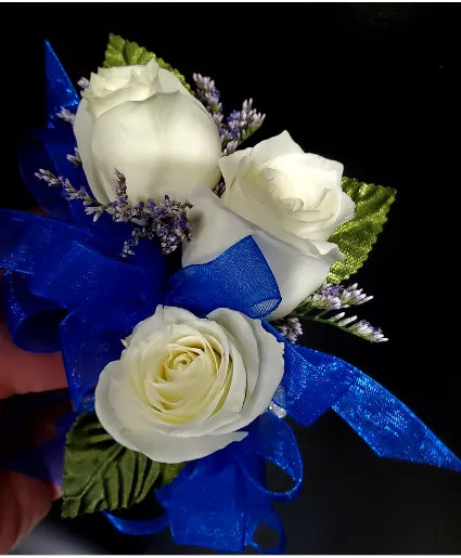 WHITE FLOWER CORSAGE WITH BLUE RIBBON